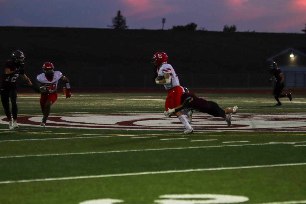 Senior Elliot Bieister tries to escape the tackle after his catch. The final score for varsity football on 9/20 was 0-28 Waverly.