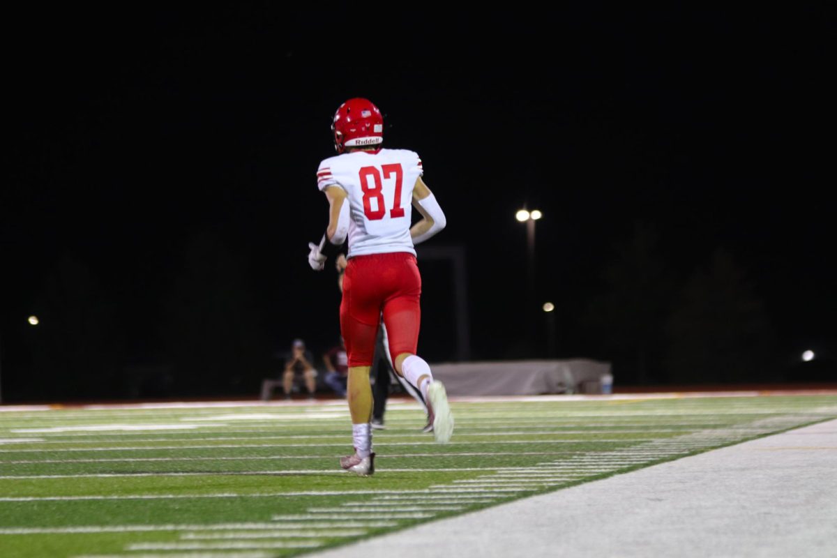 Senior Charlie Lamski is running back onto the field after the play. The final score for varsity football on 9/20 was 0-28 Waverly.