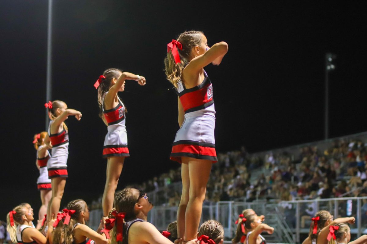 The fliers on the cheer team execute the stunt. The final score for varsity football on 9/20 was 0-28 Waverly.