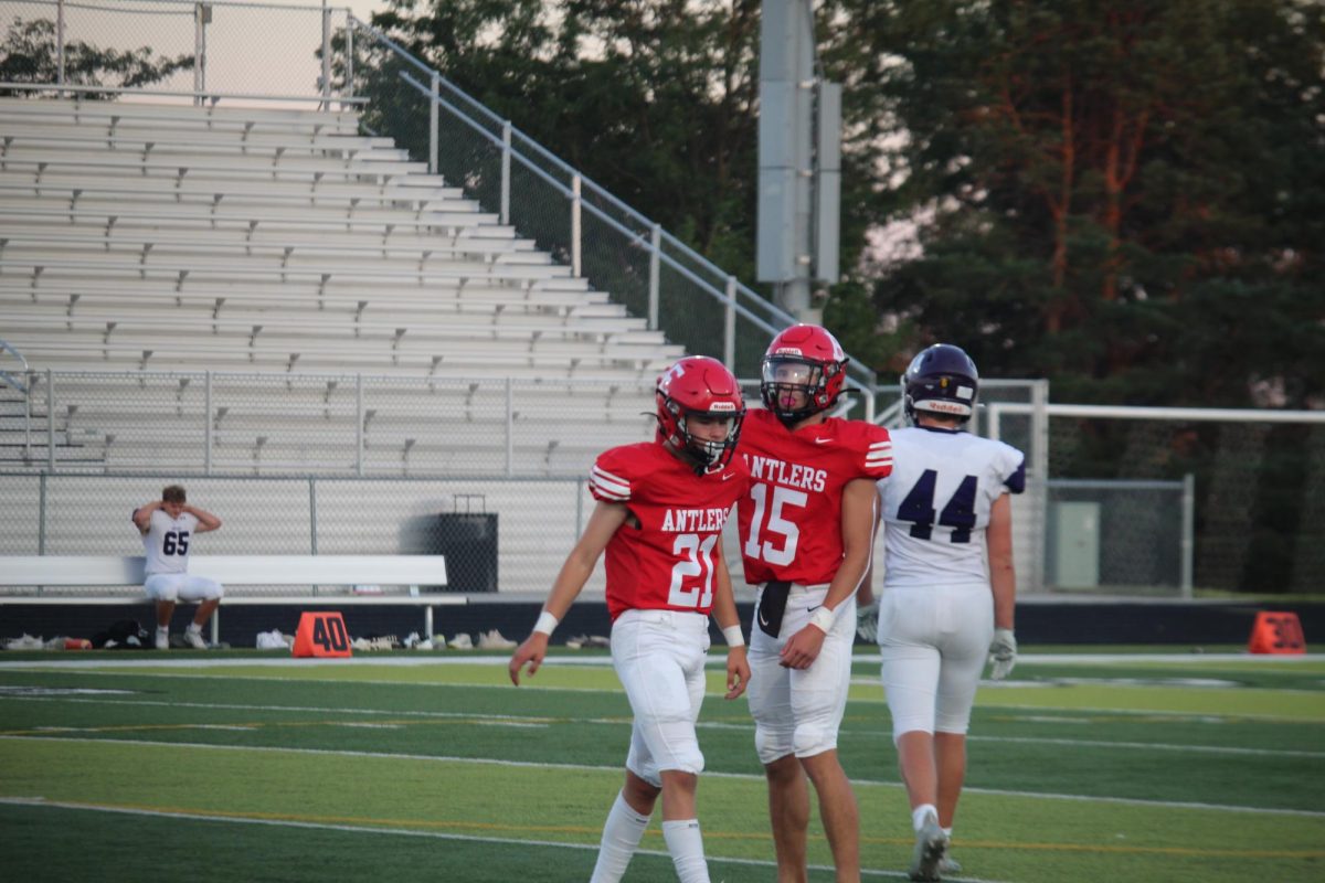 Aiden Zelasney congratulating Elijah Beister on a great pay that got the antlers a first down plus a few yards. 