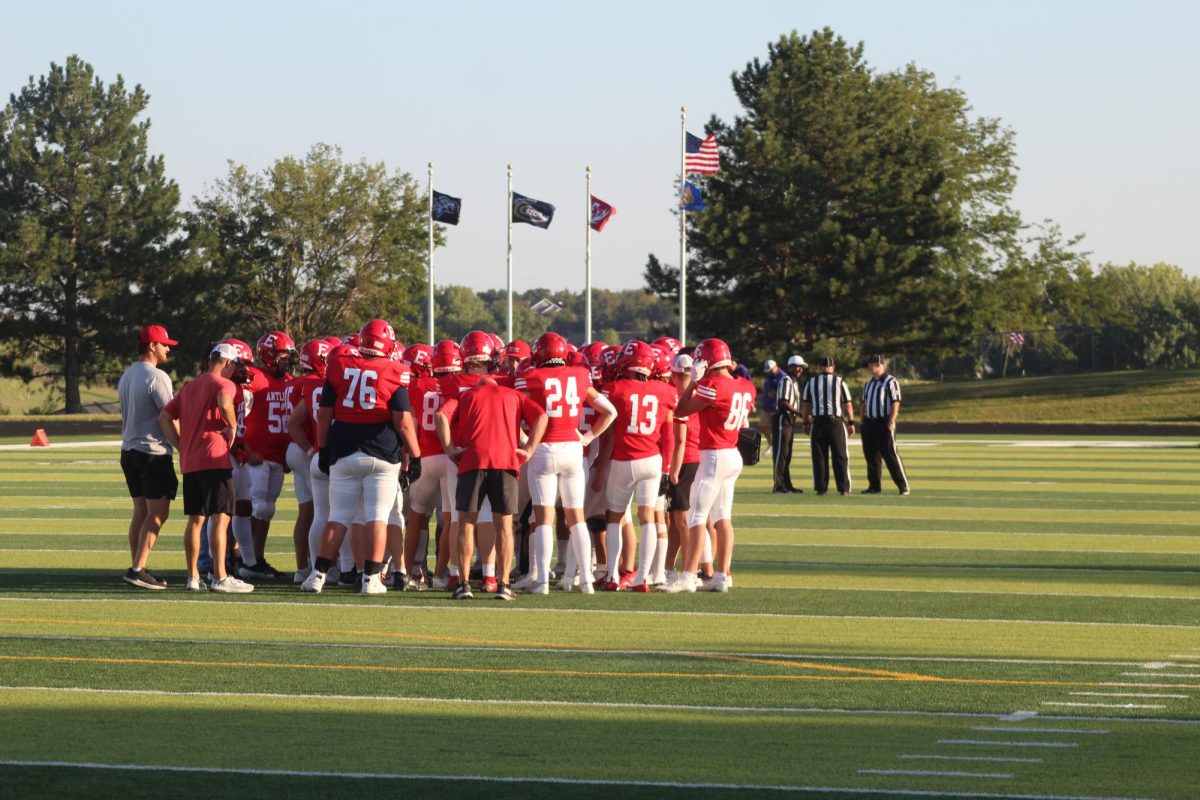 The JV team huddles in for a talk right before the game.  The JV football team beat Blair with a final score of 21 - 0.