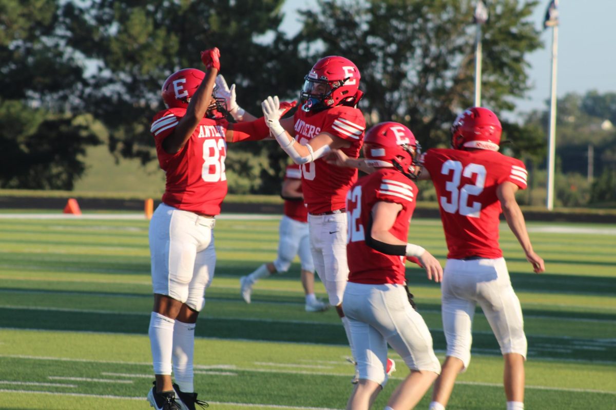 Trey Pacas and Jack Metschke celebrate after a good play.  The JV football team beat Blair with a final score of 21 - 0.