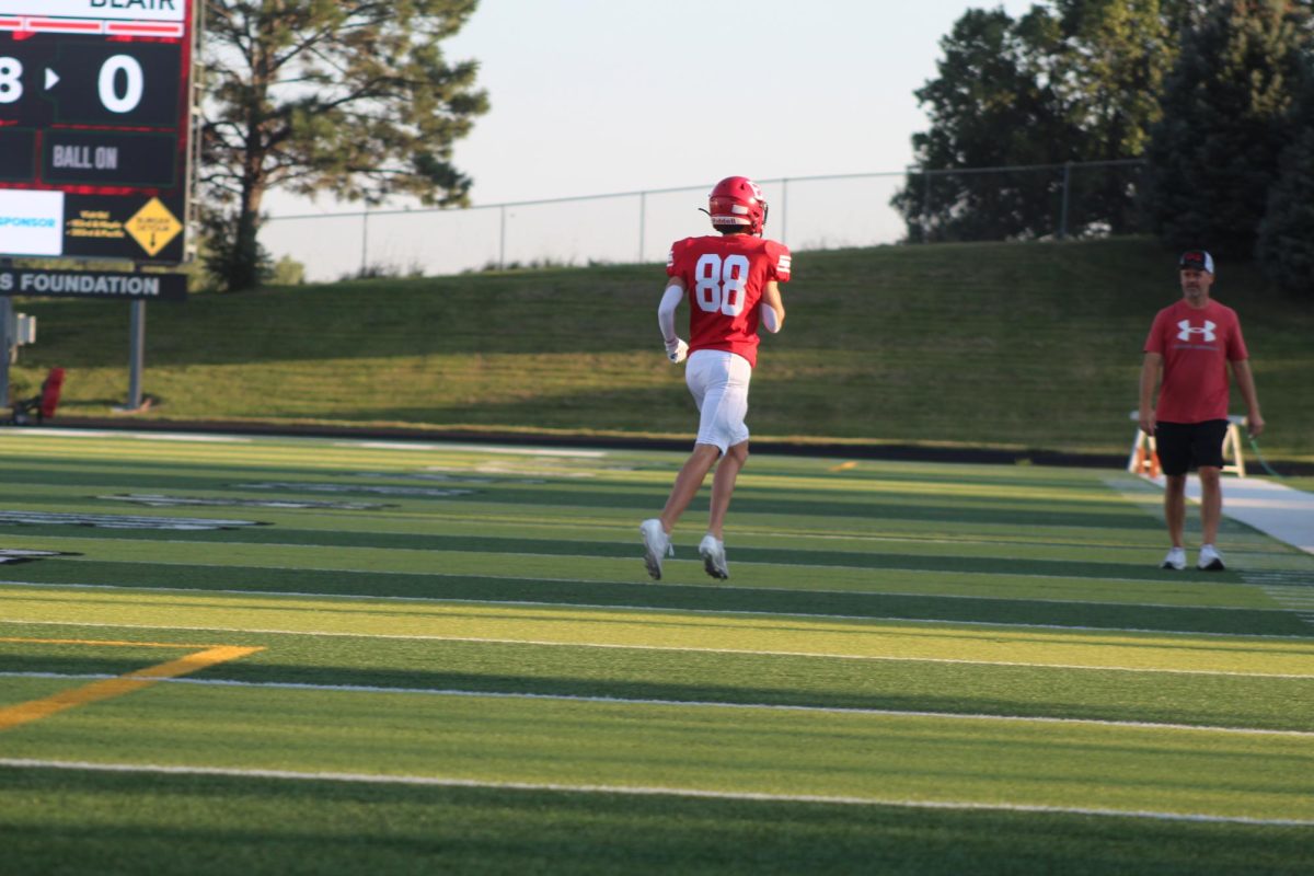 Brody Clevenger celebrates after a play.  The JV football team beat Blair with a final score of 21 - 0.