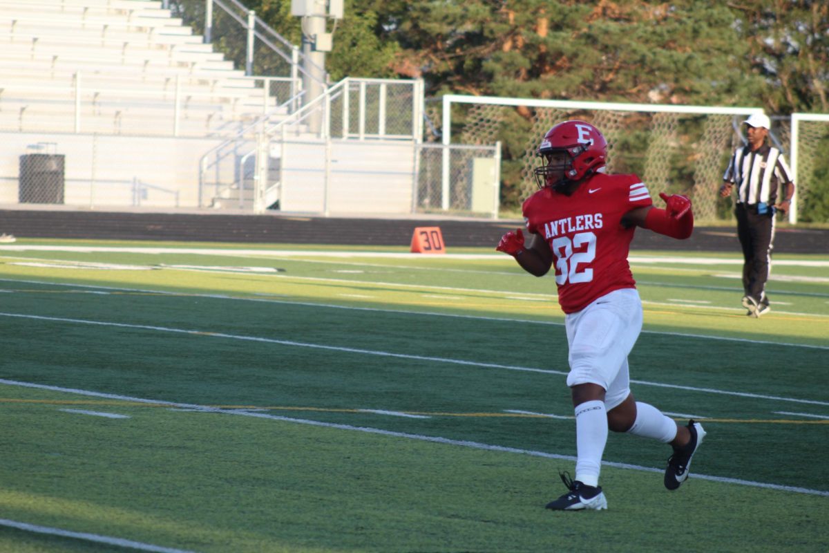 Trey Pacas runs midplay.  The JV football team beat Blair with a final score of 21 - 0.