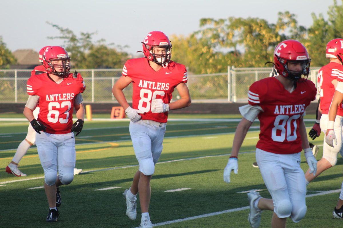 Brady Mataele runs off the field after a play.  The JV football team beat Blair with a final score of 21 - 0.