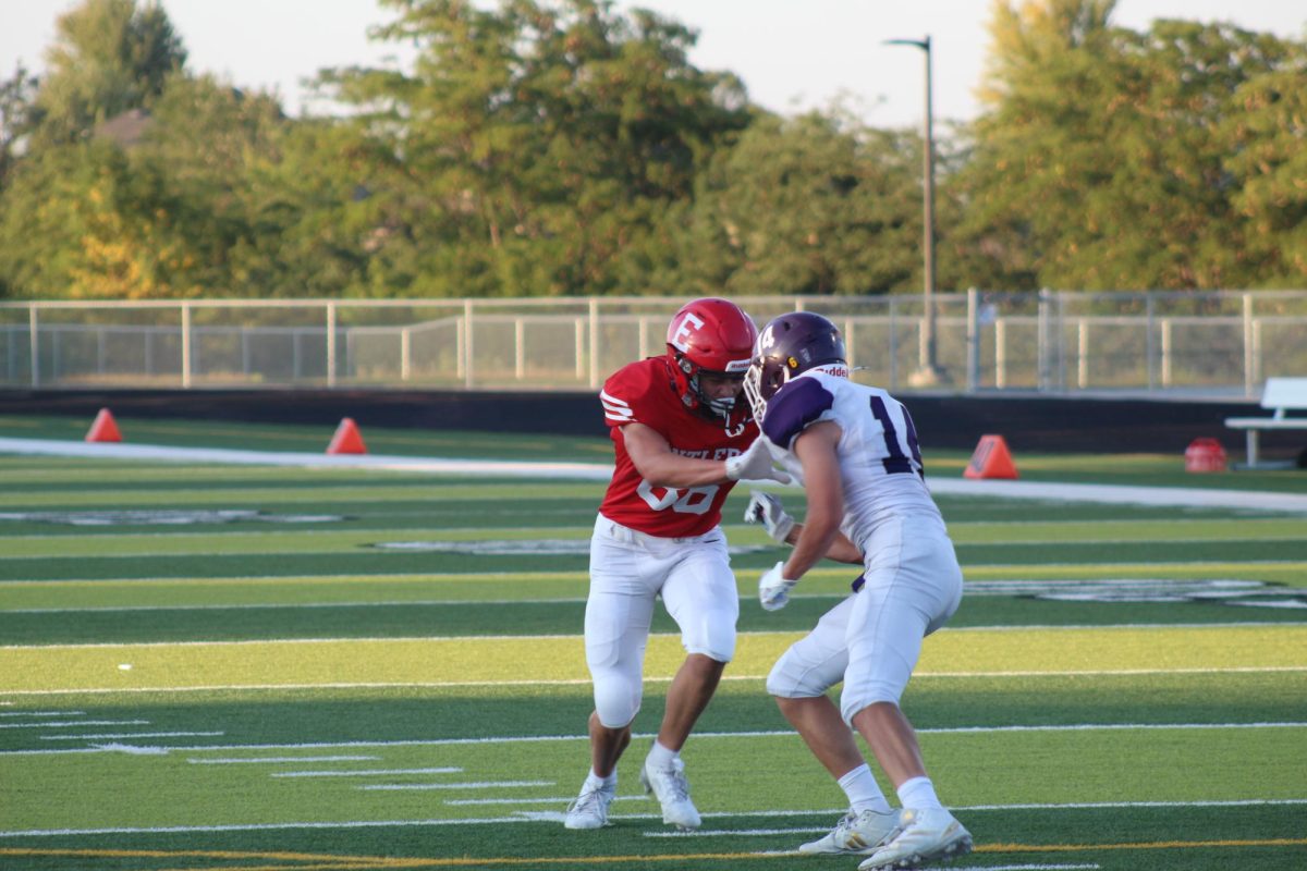 Brady Mataele blocks an opponent. The JV football team beat Blair with a final score of 21 - 0.