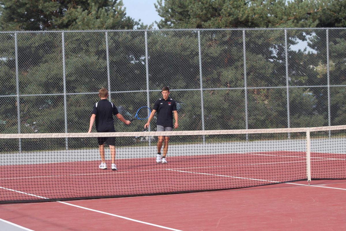 Seniors, John Karnett and Luke Bartlett, congratulating each other after winning a point. 