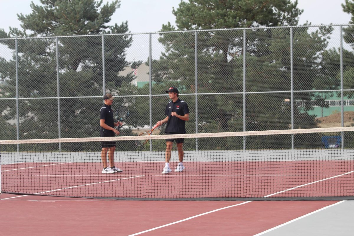 Seniors, Jarrett Paulson and Dylan Fast, after winning a point.