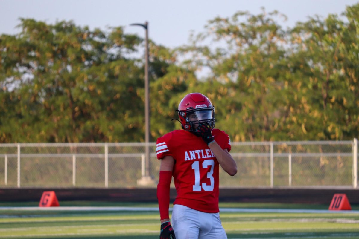 Sophomore Mathew Ott takes a second to cool off after running a great play. This took place on September 3rd during the JV Antlers vs. Blair game. 