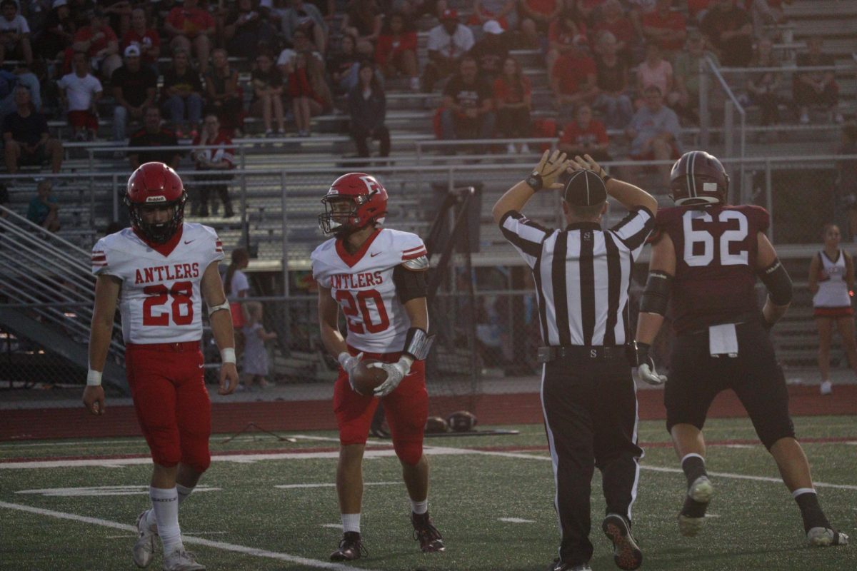 Senior Gus Schultz has the ball after the play walking off with Elliot Beister. The final score was 0-28 Waverly on Friday September 20th.