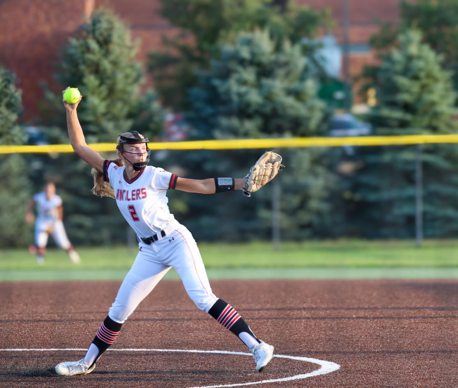 Senior pitcher Emerson Karstens winds up for a pitch against Waverly.  The Antlers won the game 15-7.