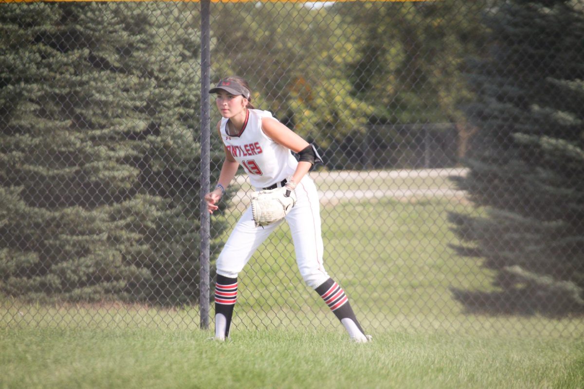 Junior Megan Erdkamp prepares incase a ball is hit to her in the outfield. This took place during the JV game versus Gretna.