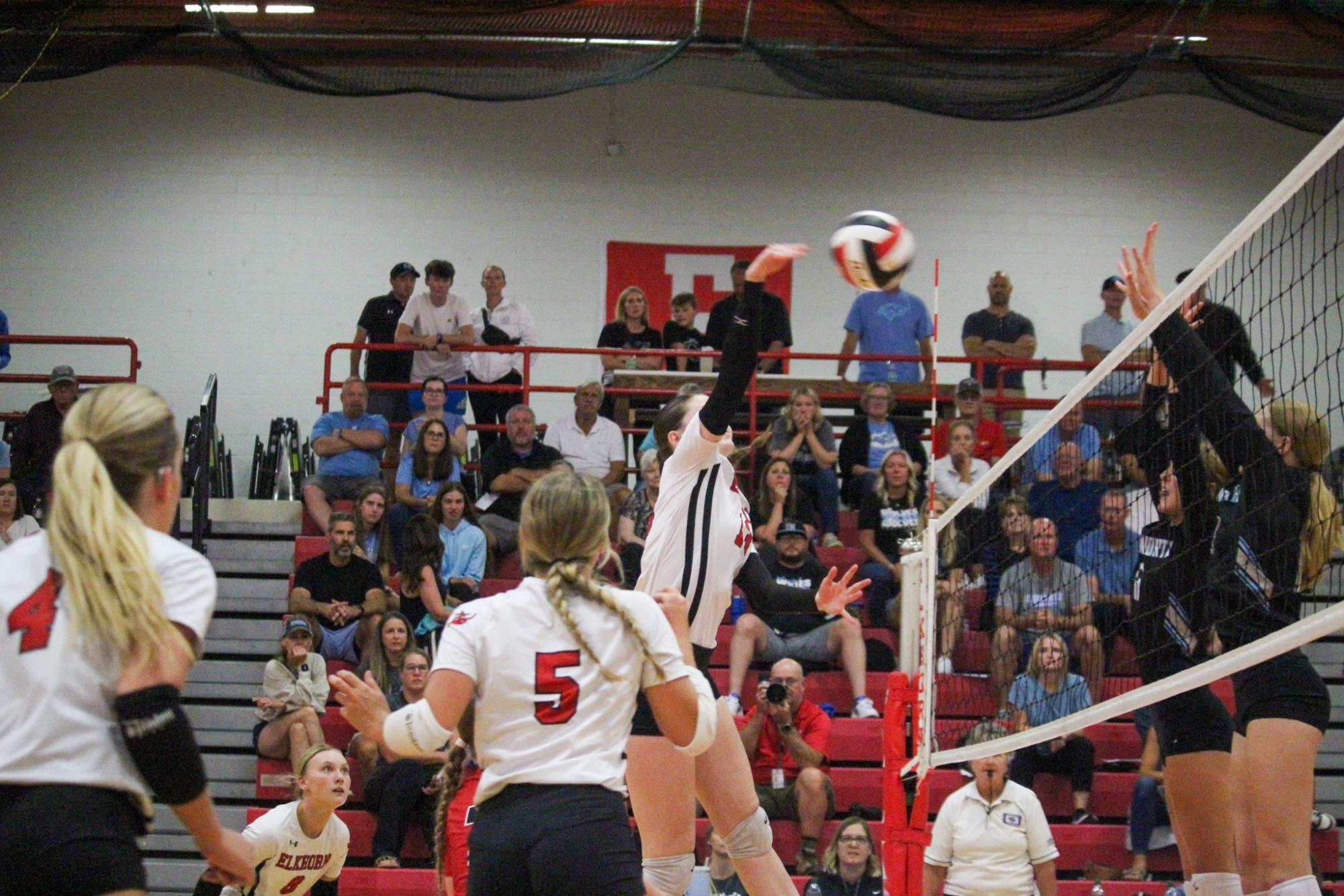 Sophomore Callie Petersen snaps her wrist as she hits the ball over the net. This took place during the varsity game on 8/29 against Elkhorn North High School. 