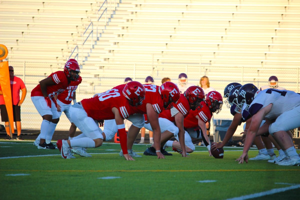 The line focuses on the ball. JV football beat Blair 21-0 on 9/3.