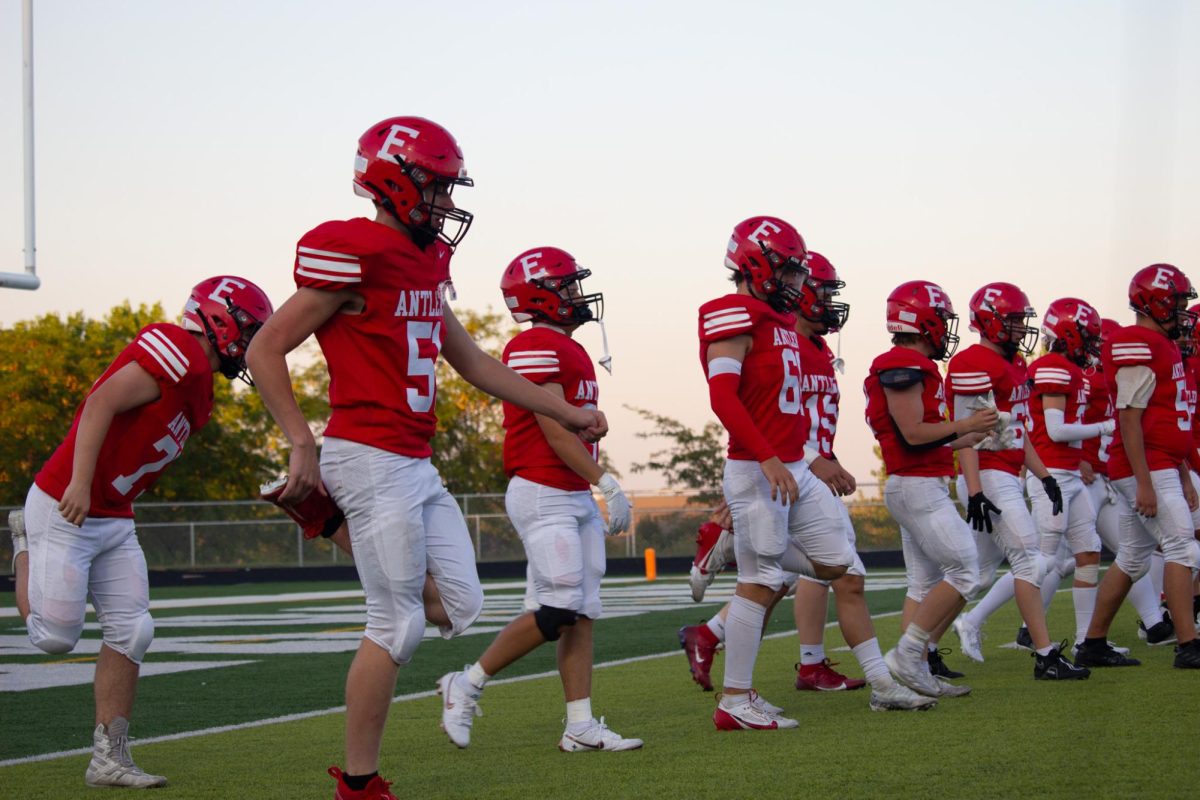 The Antlers return to the field after halftime and warm up. JV football beat Blair 21-0 on 9/3.