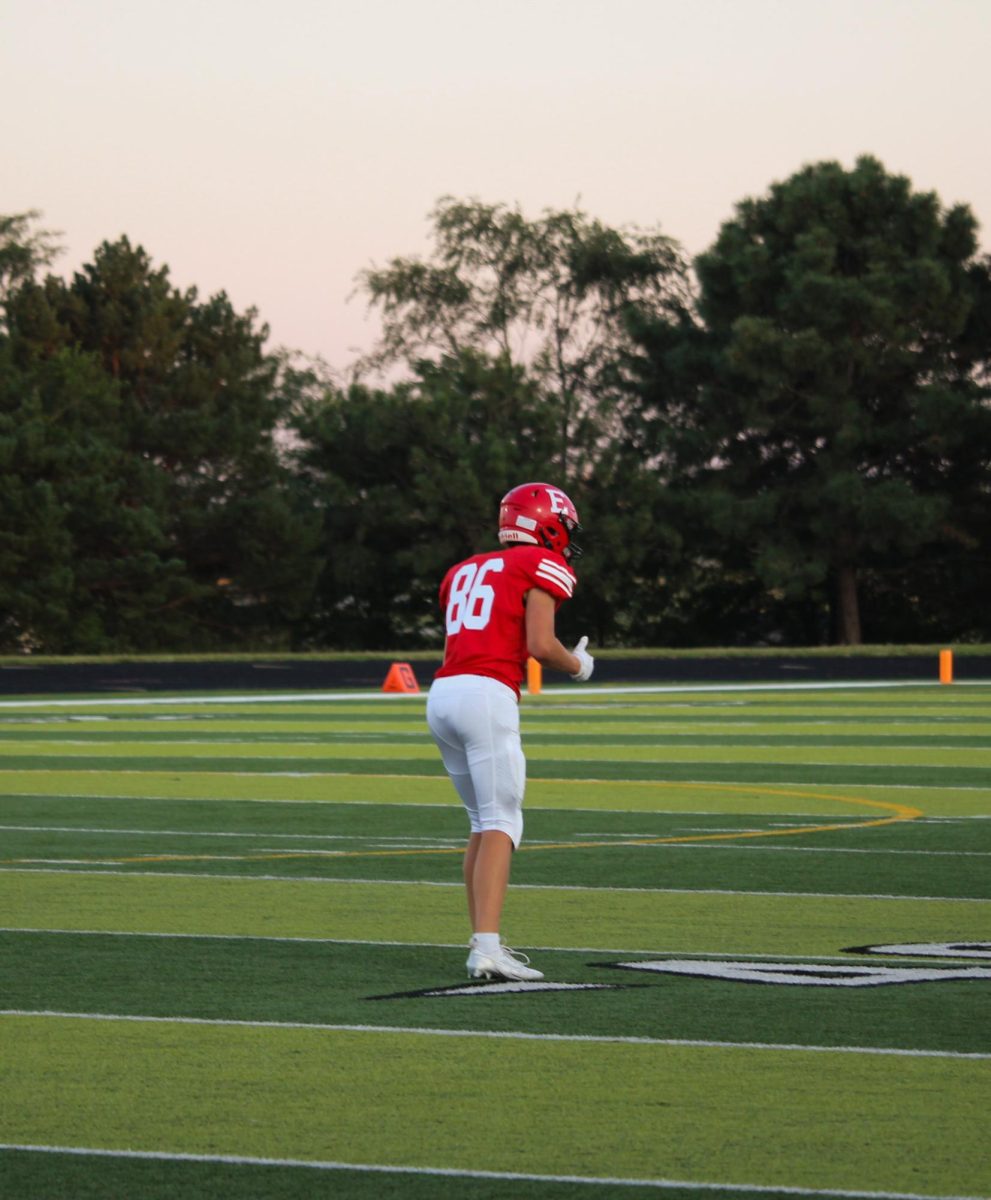 Sophomore Brady Mataele gives a sign to his coach. JV football beat Blair 21-0 on 9/3 2024.