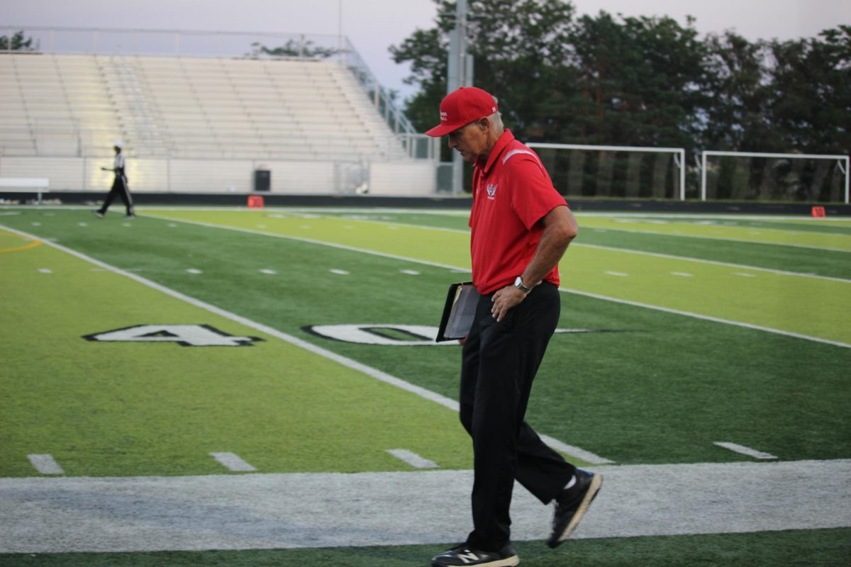 Coach Bacus paces the sideline during the 4th quarter of the game. JV football beat Blair 21-0 on 9/3 2024.