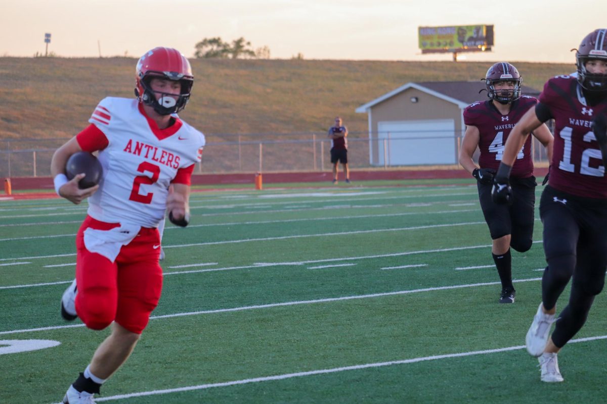 Senior Kayd Matthews is running for the endzone. The final score for varsity football on 9/20 was 0-28 Waverly.