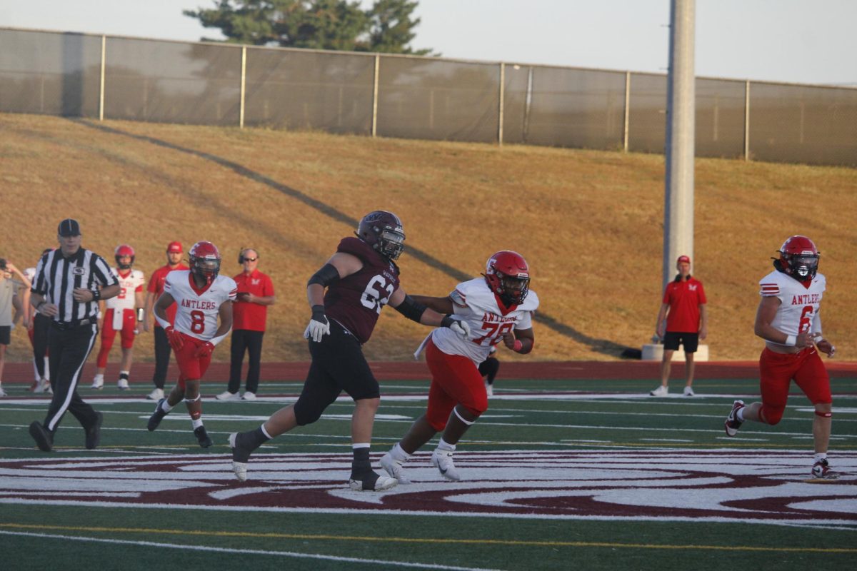 Willie Rush runs down the field getting away from a player of the opposing team. The varsity football game was on September 20th with a ending score of 0-28 Waverly. 