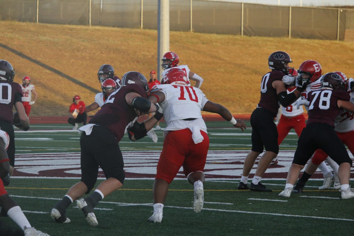 Willie Rush is not stopped while an opponent tries to tackle him. The varsity football game was on September 20th with a ending score of 0-28 Waverly. 