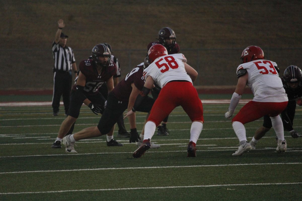 Liam Houston is tackling an opponent from the opposing team. The varsity football game was on September 20th with a ending score of 0-28 Waverly. 