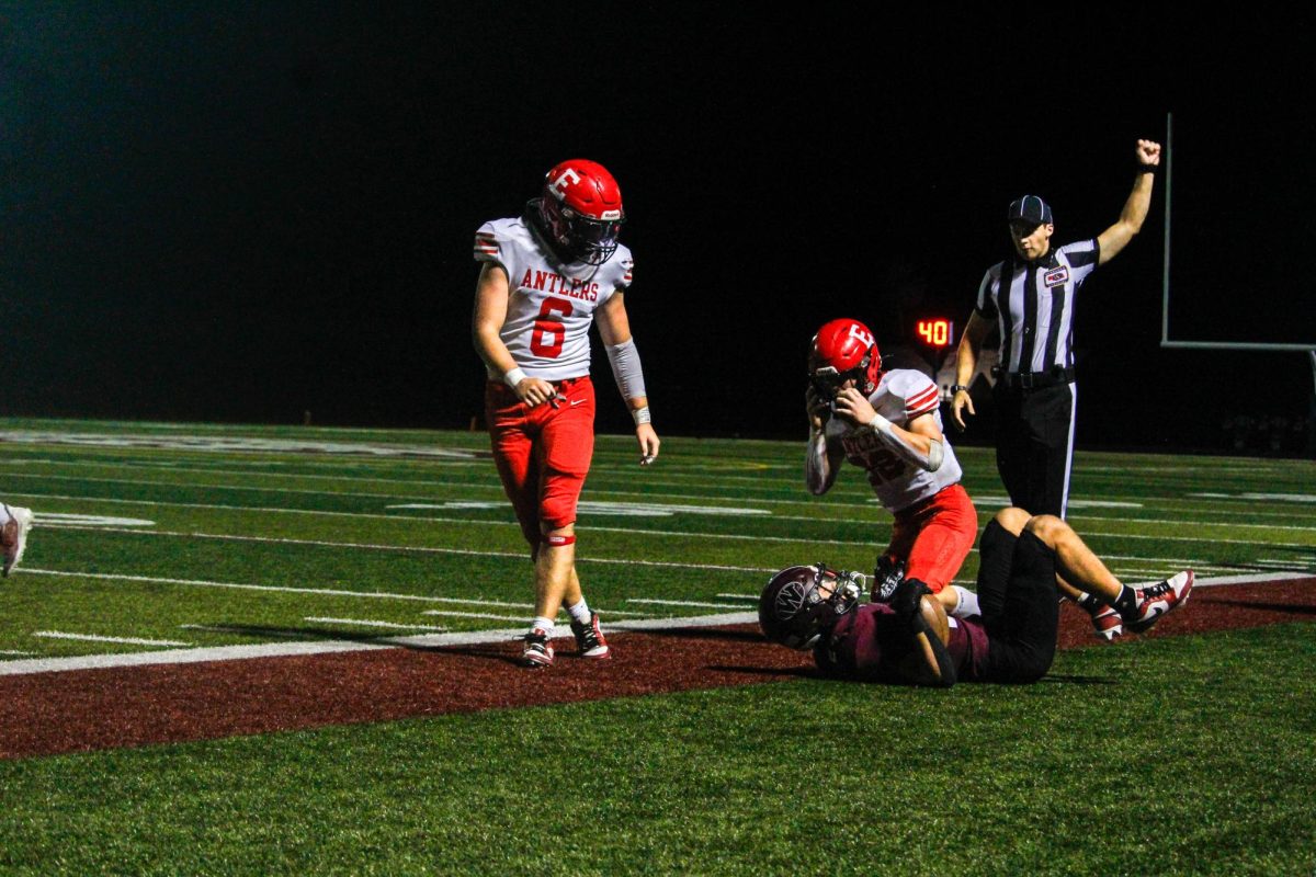 Beckett Mull looks down at the opposing teams player after he was tackled. The varsity football game was on September 20th with a ending score of 0-28 Waverly. 