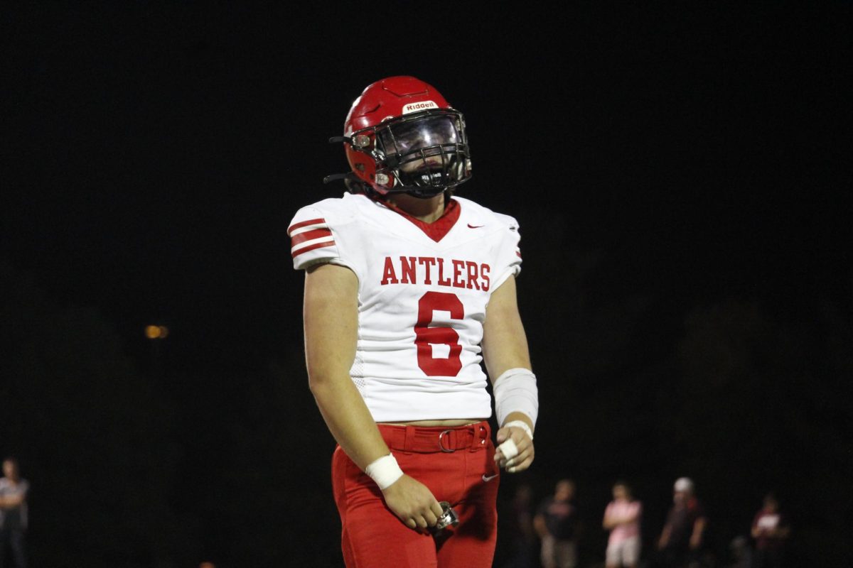 Senior Beckett Mull reacts to a play in a game against Waverly. The varsity football game was on September 20th with a ending score of 0-28 Waverly. 