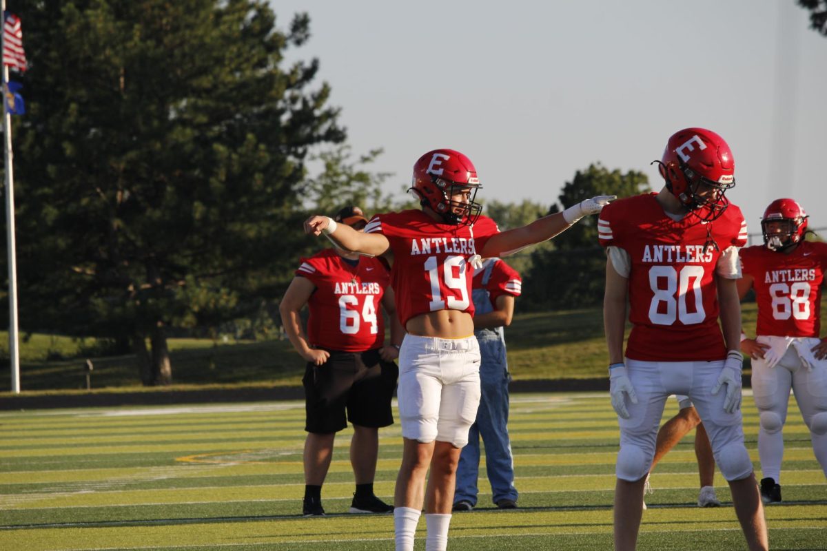 Josh Ludacka warms up beside his teammates before the game. JV football beat Blair 21-0 on 9/3 2024.