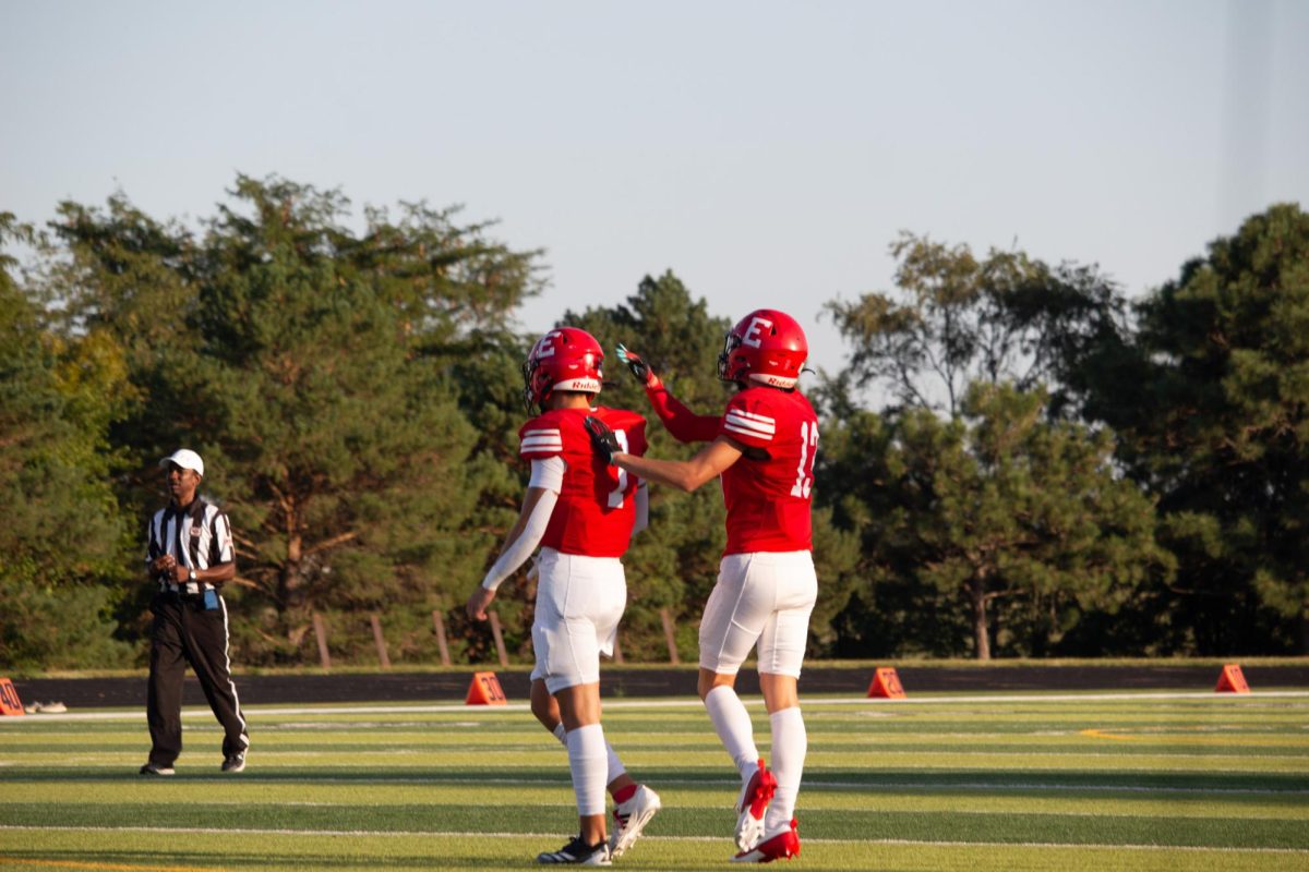 Sophomore Matthew Ott pats his teammate Baron Clevenger on the back after a successful play. JV football beat Blair 21-0 on 9/3 2024.