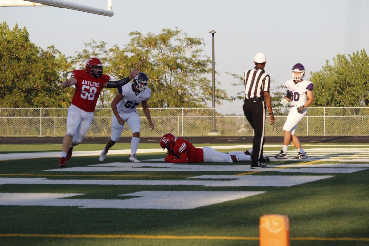 Sophomore Trey Pacas dives on the ground and scores a touchdown.  JV football beat Blair 21-0 on 9/3 2024.