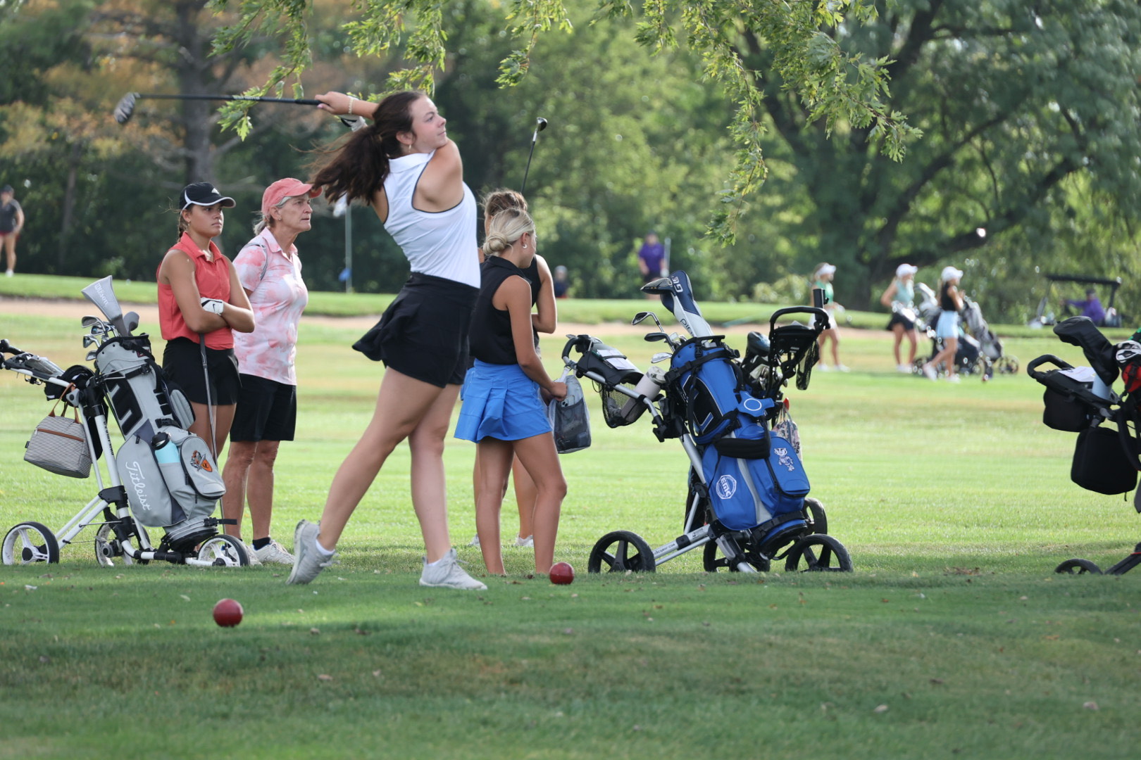 Junior Ruby Lamski watches the golf ball's flight after her drive. Lamski played in her first state tournament this season.
Photo courtesy of Ben Meyer