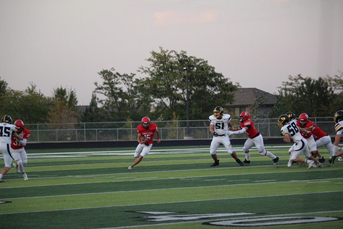 Junior, Aiden Zelansey cutting through the field.