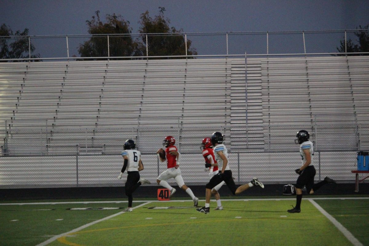 Junior, Reid Steic scoring a touch down.