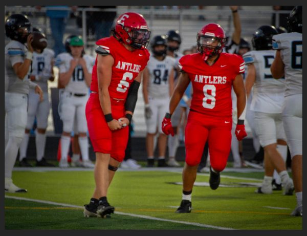 Senior Beckett Mull and Junior Koby Johnson celebrate after getting a stop on 3rd down. The Antlers beat rival ENHS 17-14.