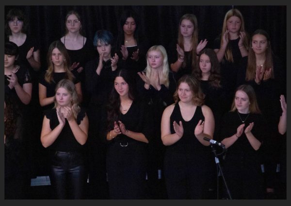 The choir group singing a group song. 