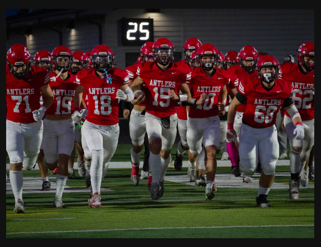 The Antlers take the field after halftime at a recent game. The team celebrated its 75th anniversary this season.