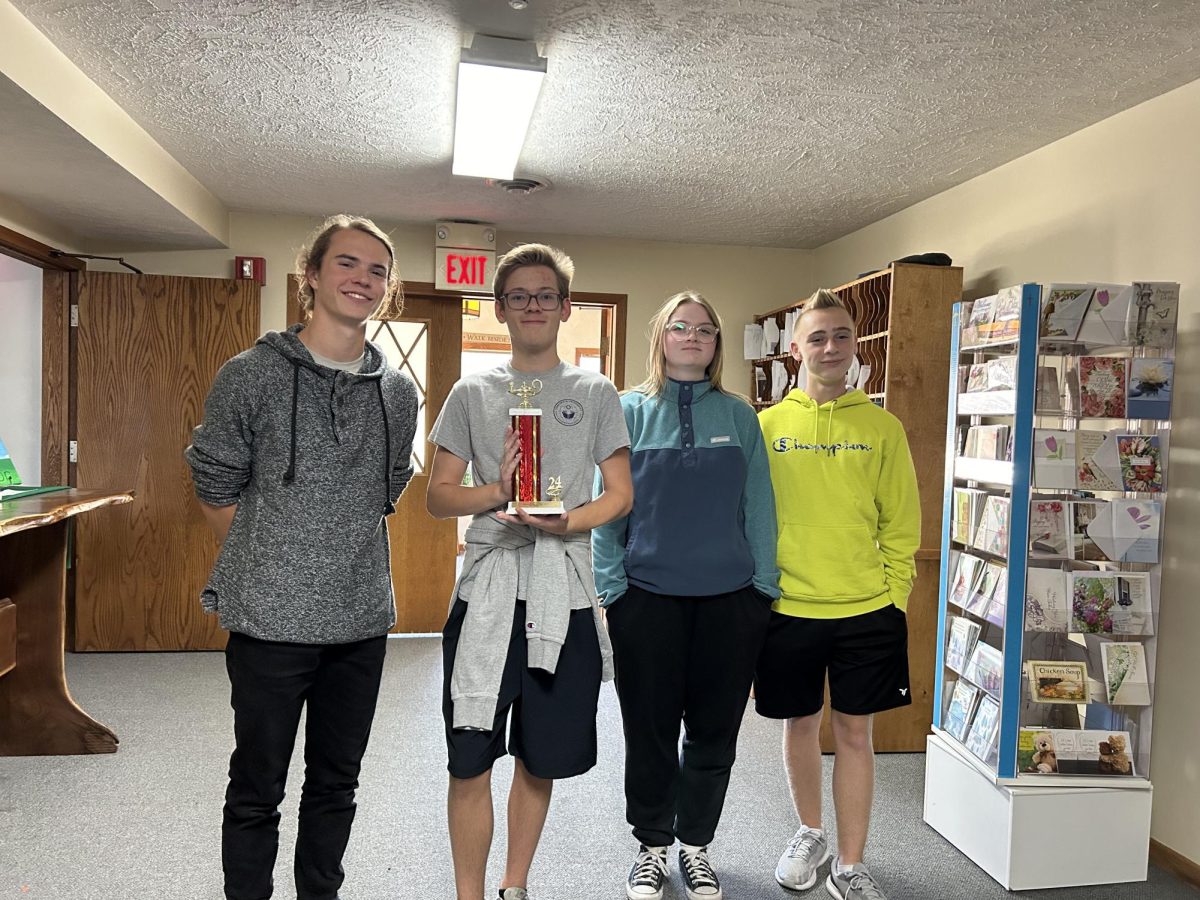 Junior Carson Deprez (holding trophy) celebrates with his Quiz Bowl teammates. The team placed 2nd overall at the competition.
Photo courtesy of Molly Erickson