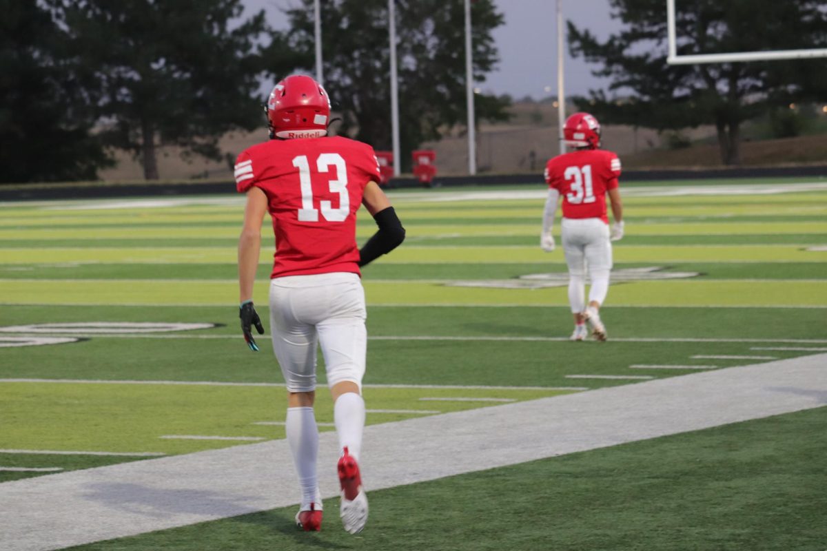 Sophomore, Matthew Ott, running back to get into position. 