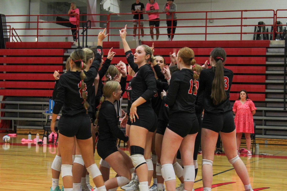 The Antler volleyball team gets together before the game begins. This took place on 10/3, and the Antlers lost to Bellevue East 2-1.