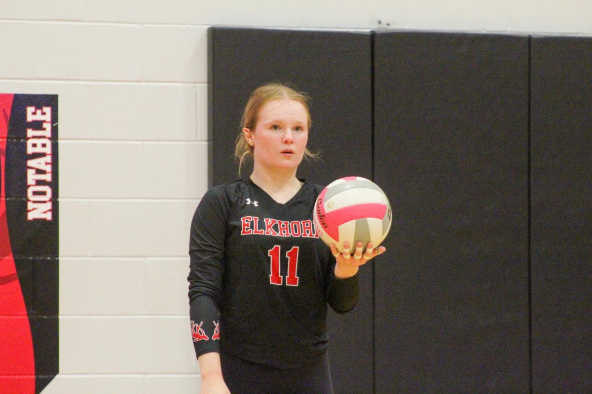 Senior Macie Burson prepares herself for the upcoming serve. This game took place on 10/3, and the Antlers lost to Bellevue East 2-1.