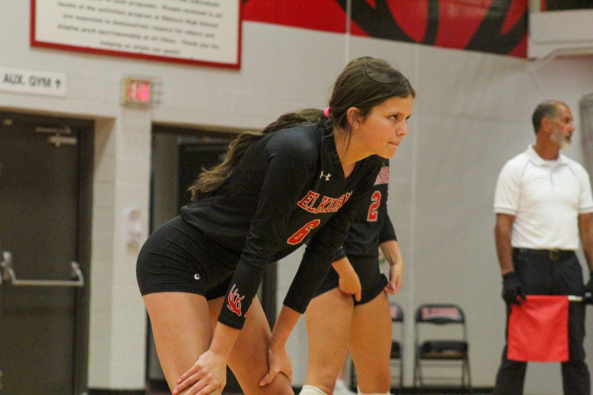 Sophomore Kaiya Gilbert with her hands on her knees as she gets ready for the serve. This game took place on 10/3, and the Antlers lost to Bellevue East 2-1.