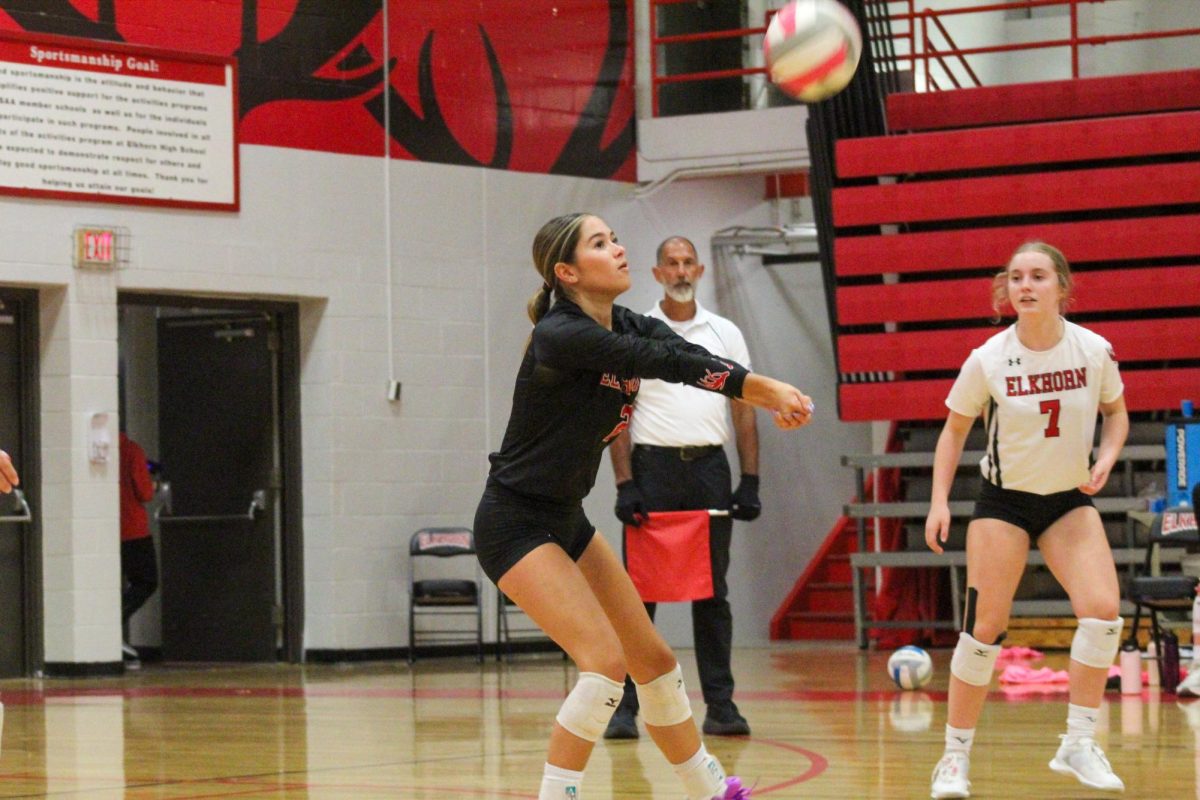 Senior Tatum Zegers prepares her arms to get a good pass. This game took place on 10/3, and the Antlers lost to Bellevue East 2-1.