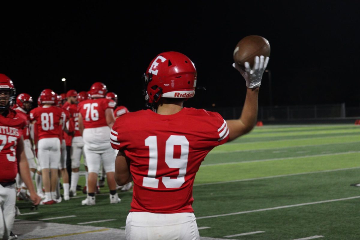 Sophomore, Josh Ludacka, warming up on the sideline getting ready to get back in game.