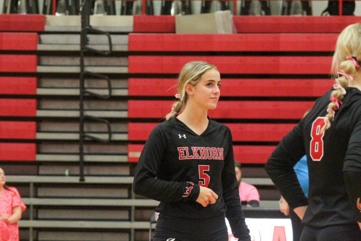 Senior Lauren Fast smiles to her teammate. This game took place on 10/3, and the Antlers lost to Bellevue East 2-1.