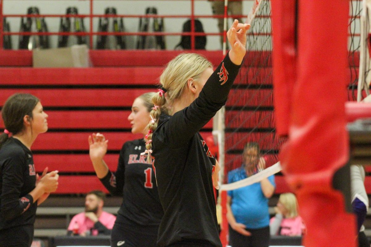 Sophomore Charley Weeder holds her hands up to prepare for the serve. This game took place on 10/3, and the Antlers lost to Bellevue East 2-1.