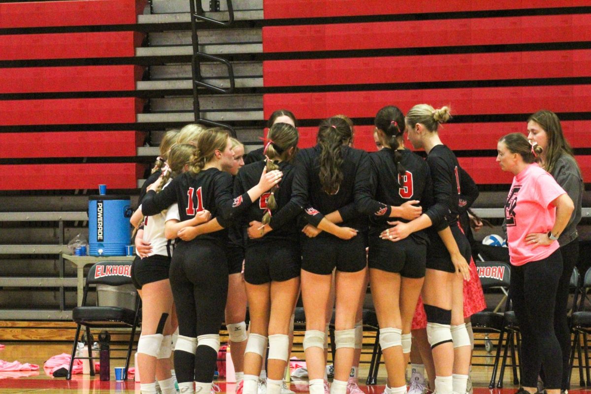 The Antler volleyball team huddles up to talk things over. This game took place on 10/3, and the Antlers lost to Bellevue East 2-1.