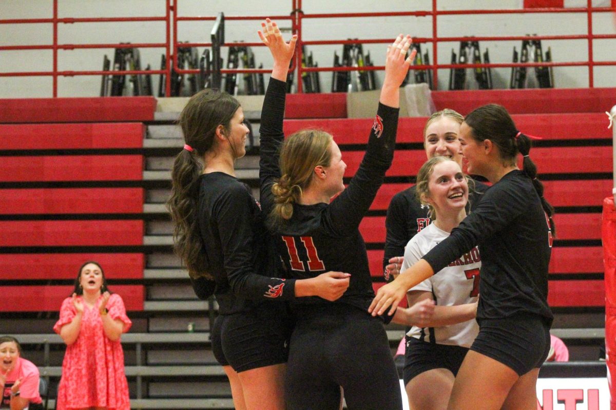 The Antlers smile excitedly after winning a point. This game took place on 10/3, and the Antlers lost to Bellevue East 2-1.