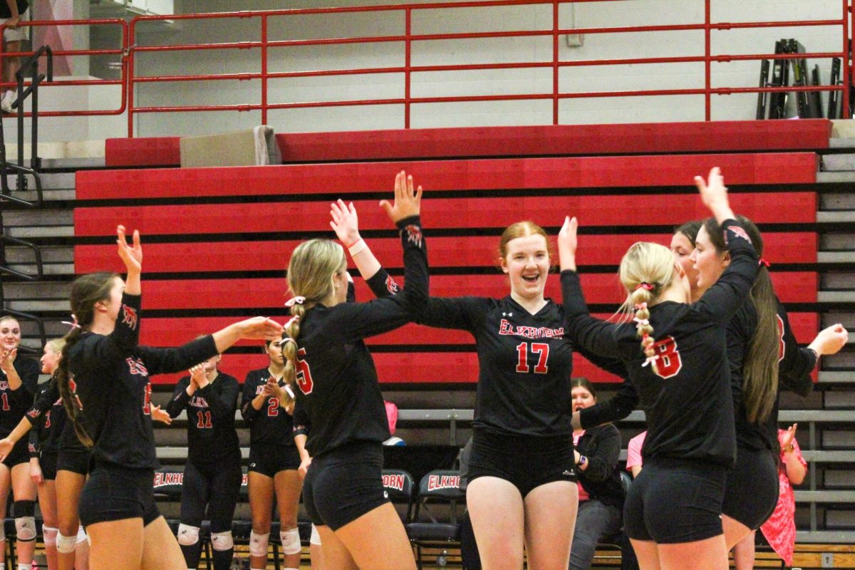 The Antlers throw their hands up in excitement. This game took place on 10/3, and the Antlers lost to Bellevue East 2-1.