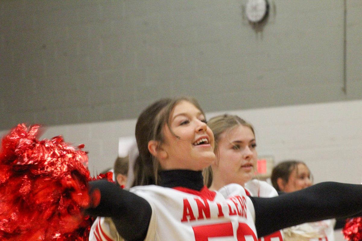 Junior Parker Stevens smiles to the crowd. This took place during the Homecoming pep rally on Friday the 4th.