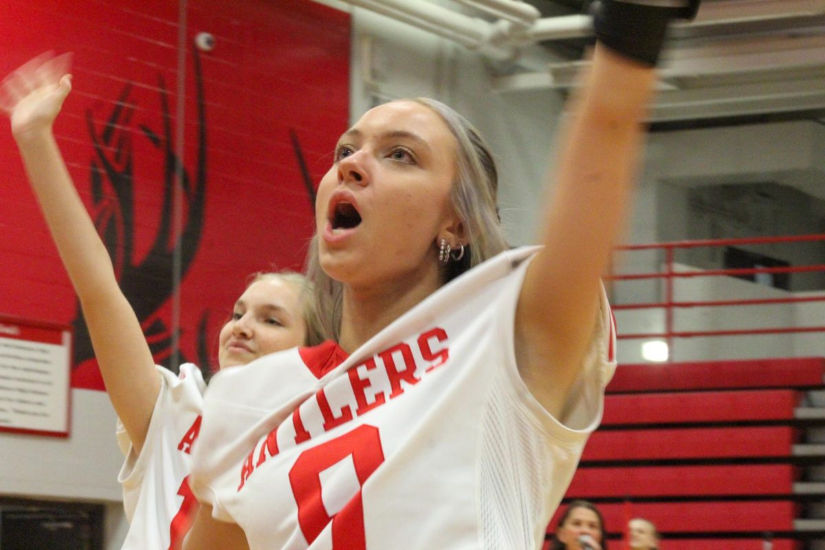 Senior Evelyn Turner waves to the crowd. This took place during the Homecoming pep rally on Friday the 4th.